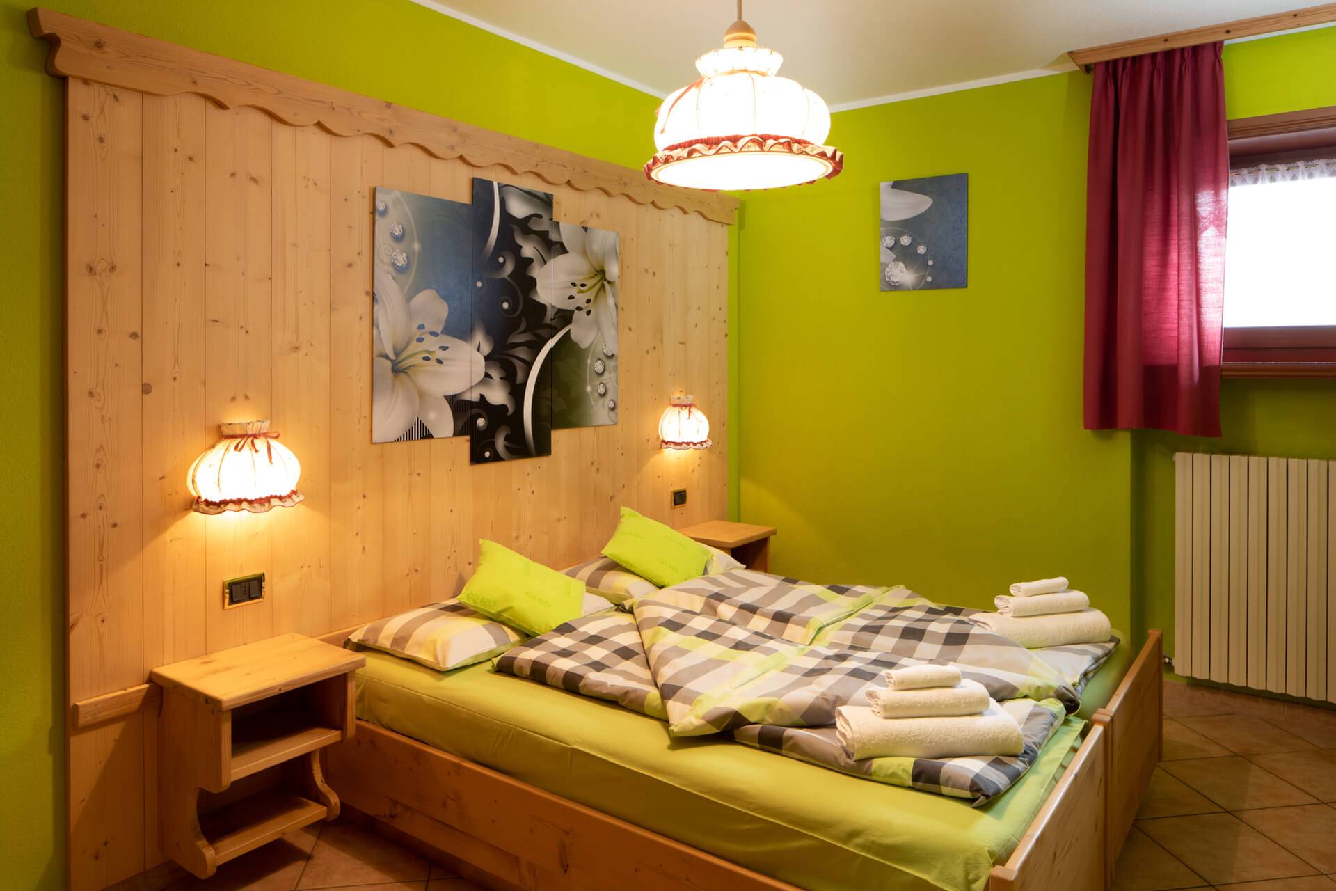 Confortevole camera doppia nell'Appartamento Verde di Baita Ruscello
